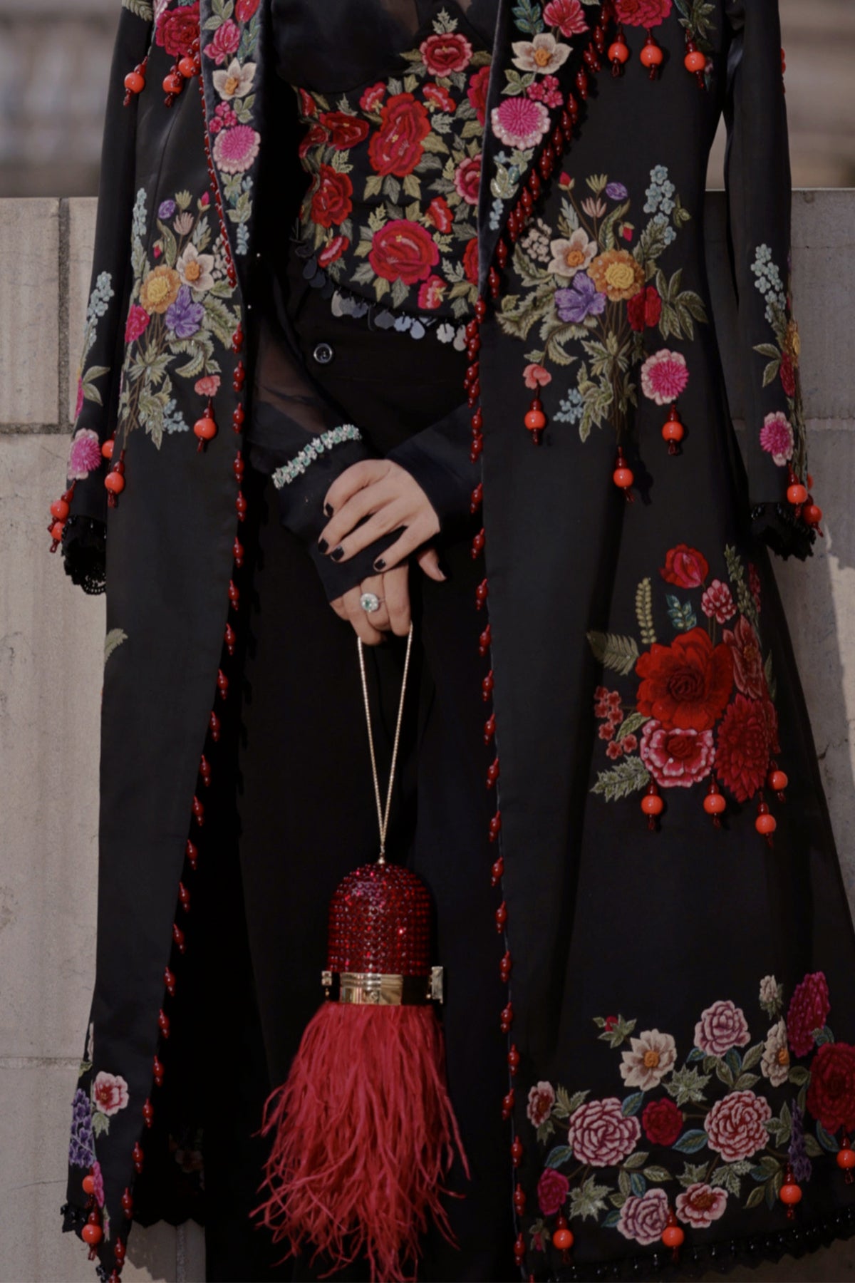 Niki Mehra in Trenchcoat with corset belt set