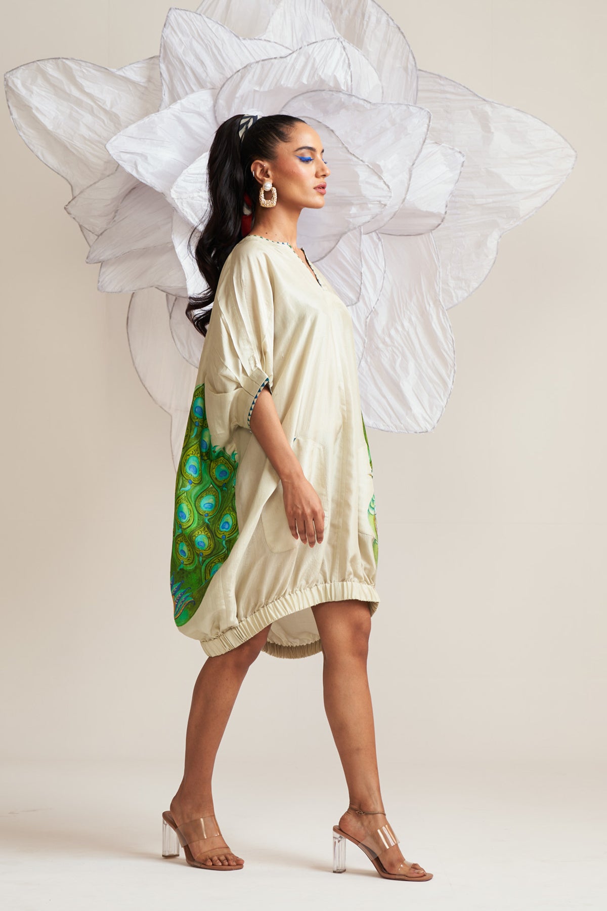 Dress with elasticated hem