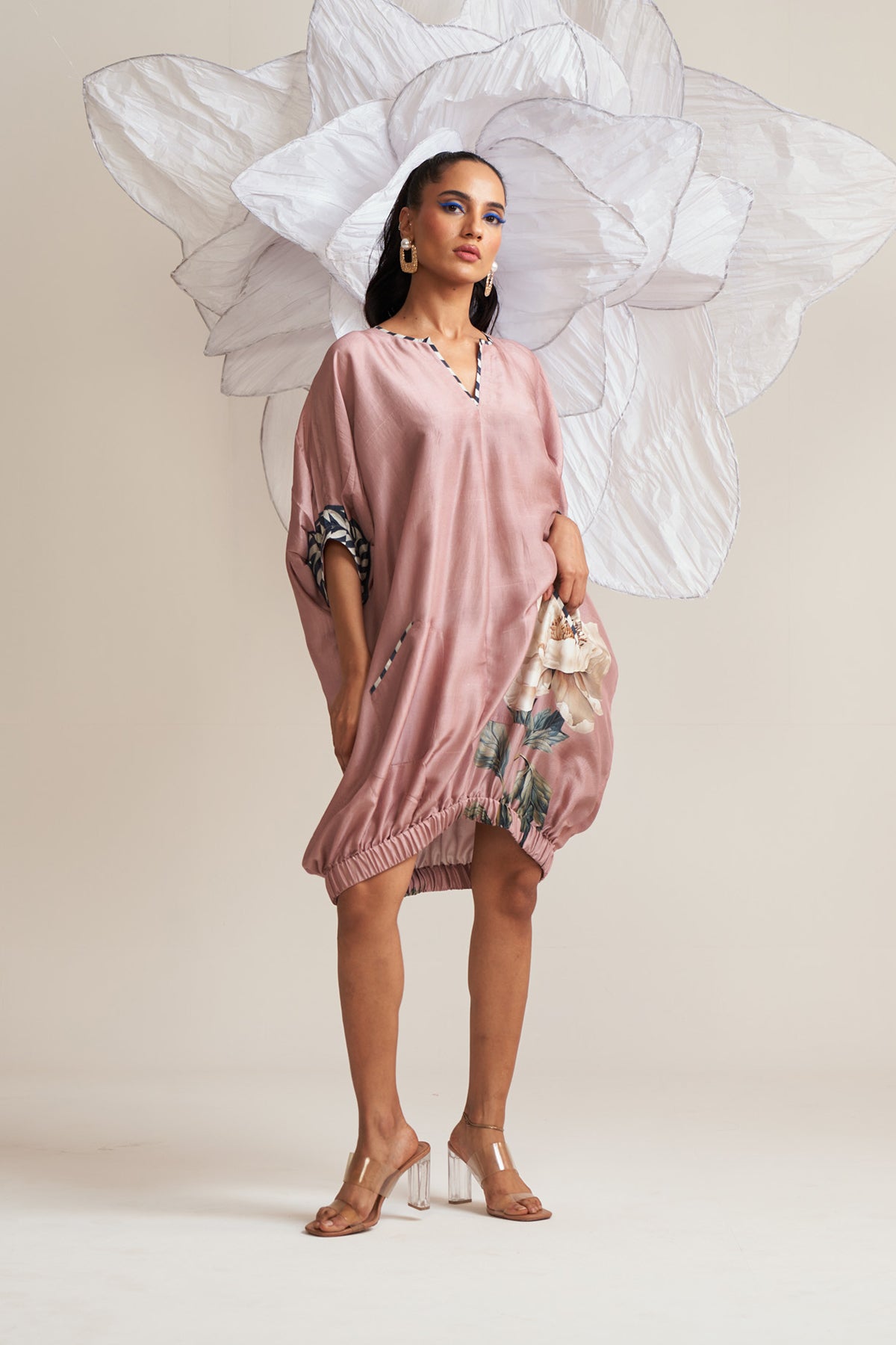 Dress with elasticated hem