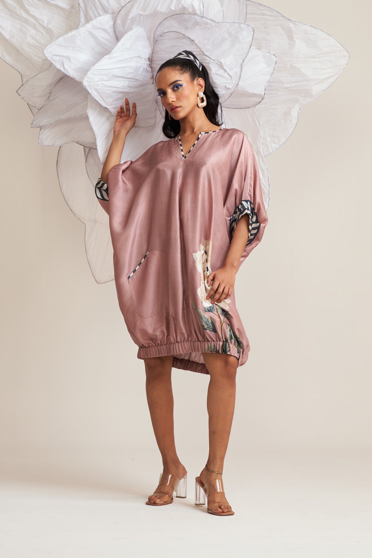 Dress with elasticated hem
