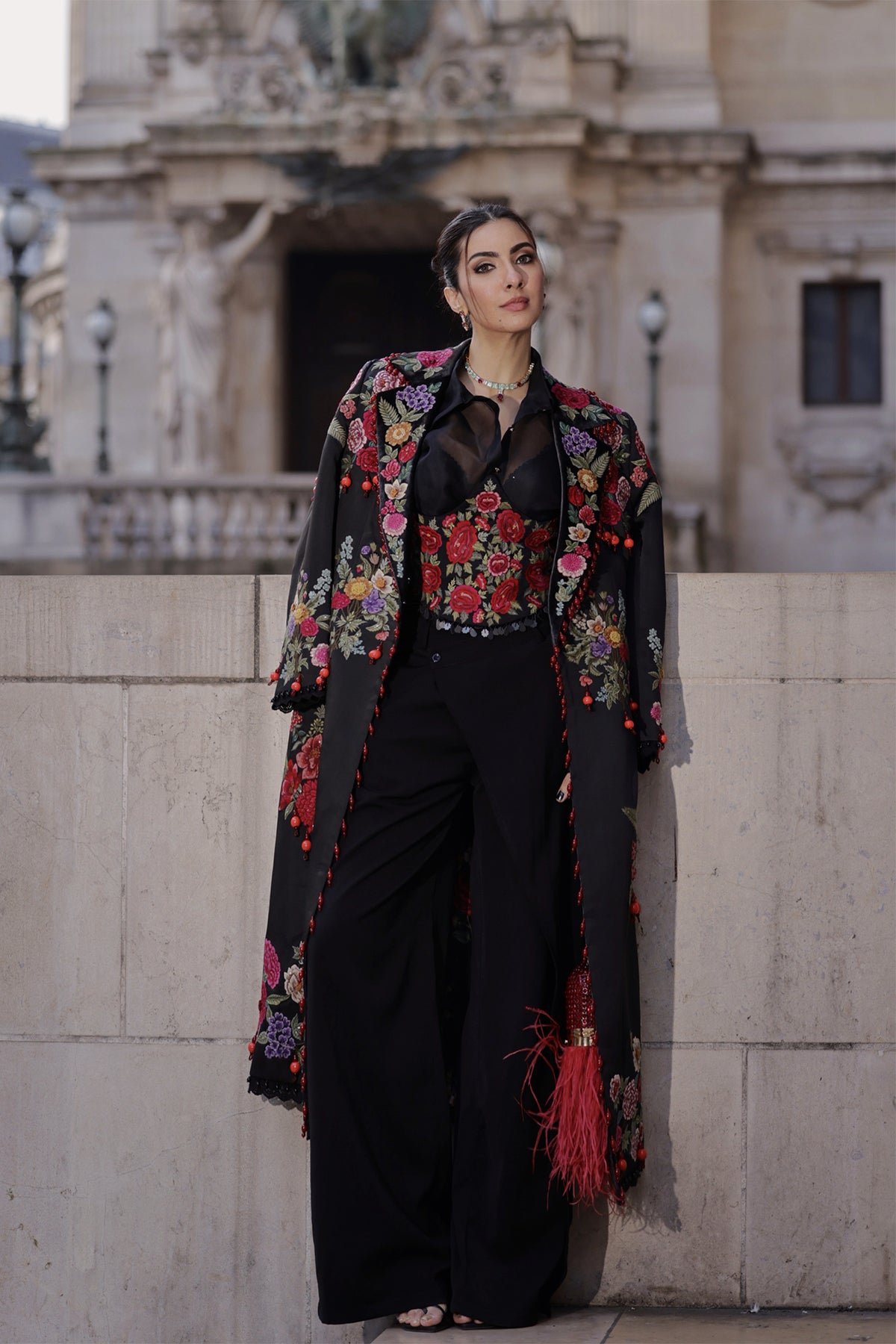 Niki Mehra in Trenchcoat with corset belt set